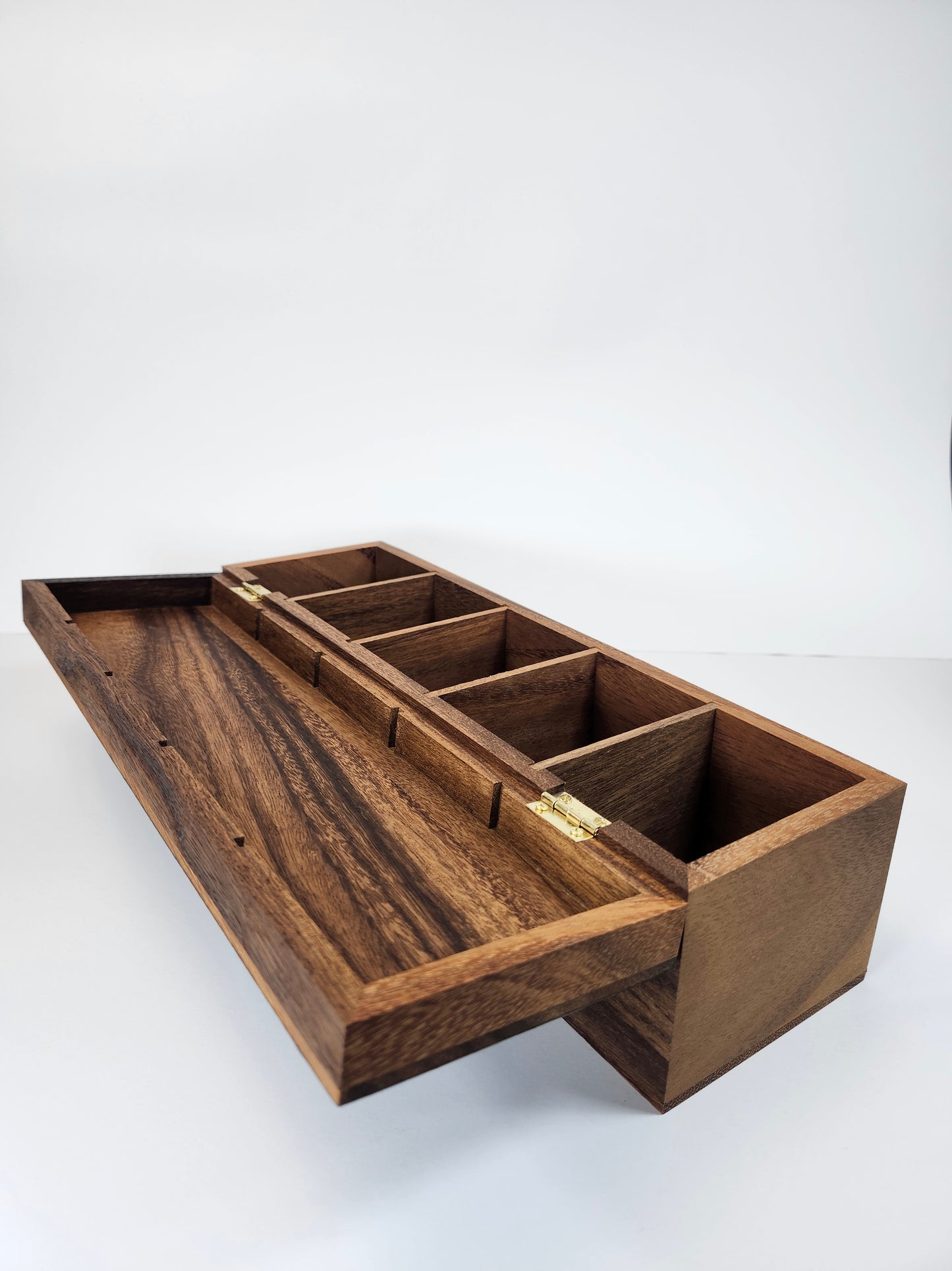 Inside view of a 13.75-inch long, 4-inch tall walnut tea box, emphasizing its sleek design and craftsmanship.