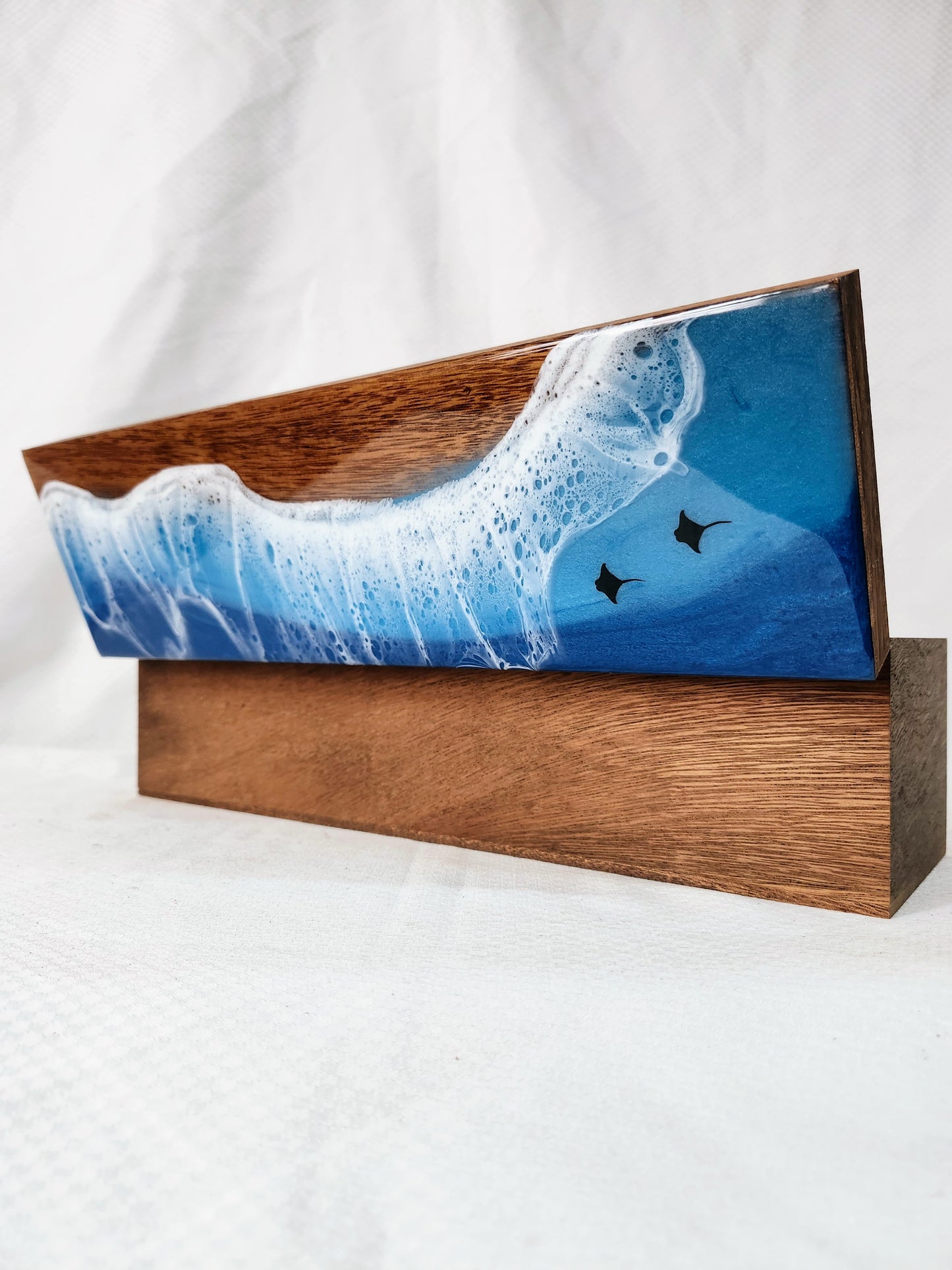 Wooden box with a blue wave design and stingrays