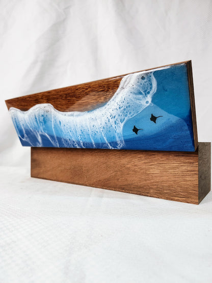 Wooden box with a blue wave design and stingrays