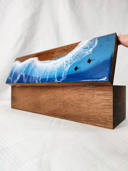 Wooden box with a blue wave design on a white background